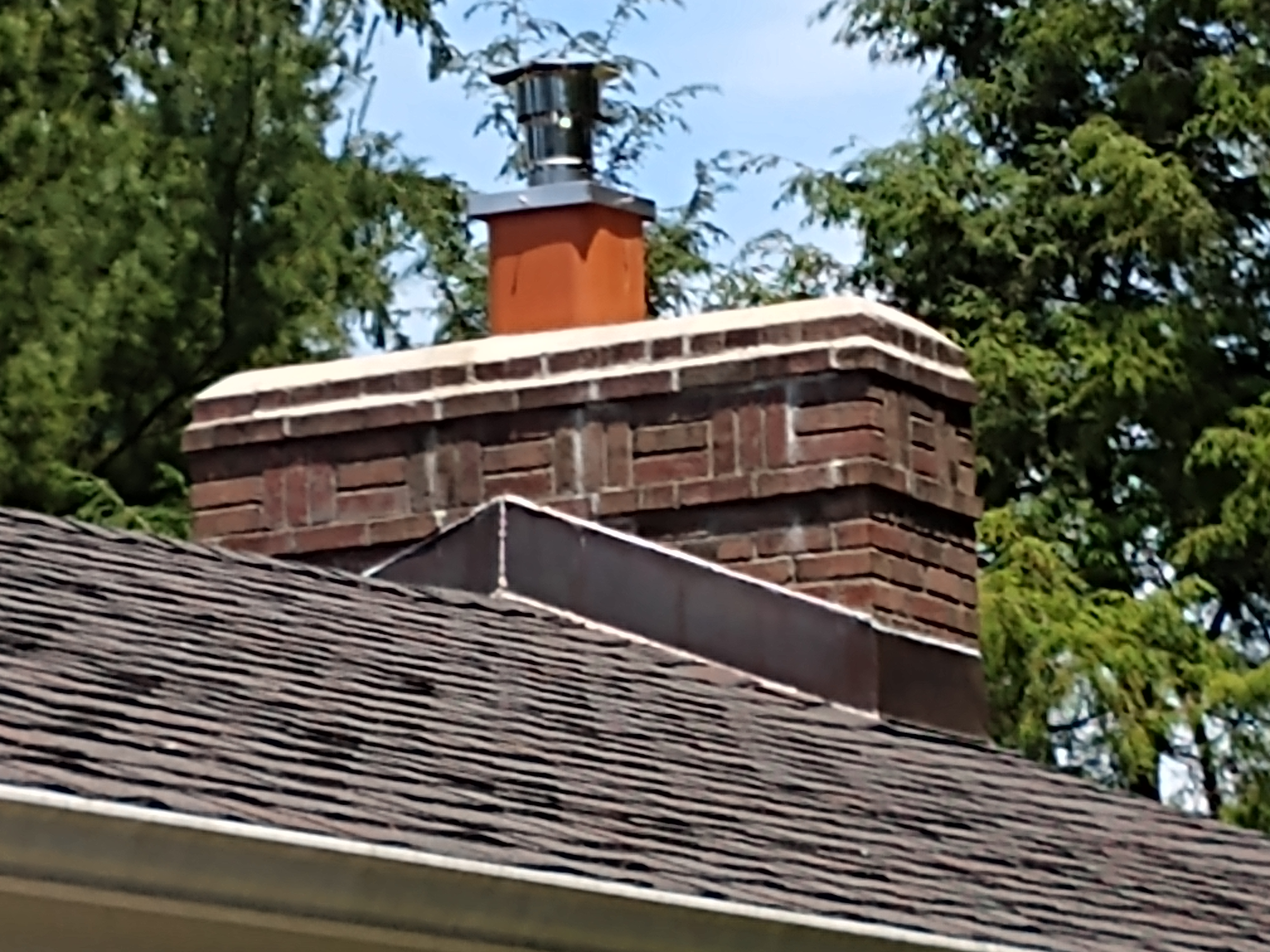 Stainless steel chimney cap with animal guard in Dix Hills, New York